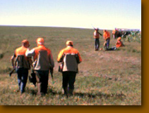 Hunting party in the field.